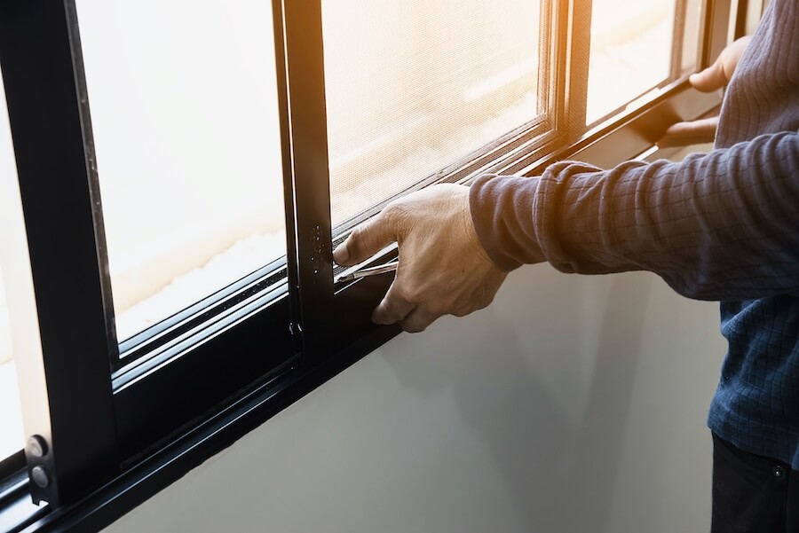 Person working on an aluminium window