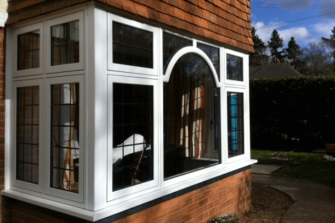 White flush windows with curved bars